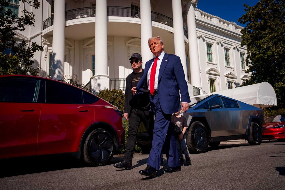 President Donald Trump and White House Senior Advisor, Tesla and SpaceX CEO Elon Musk depart after looking at Tesla vehicles on the South Lawn of the White House on March 11, 2025