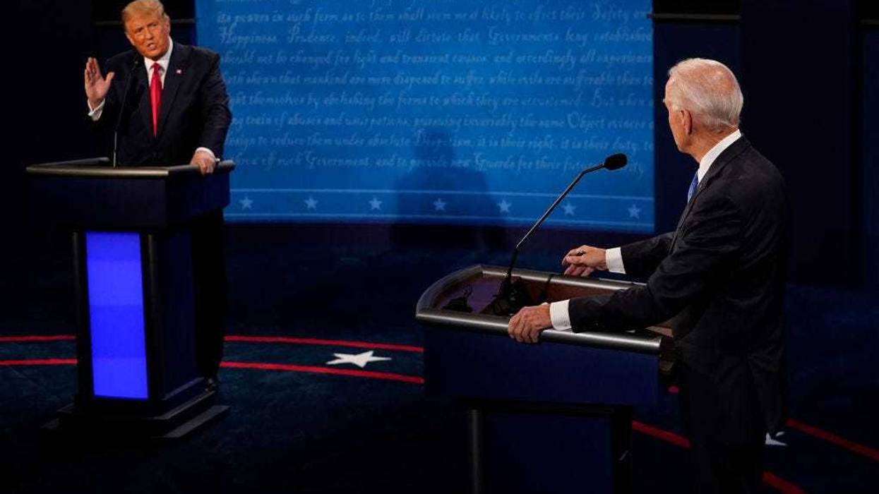 President Donald Trump answers a question as Democratic presidential candidate former Vice President Joe Biden listens during the second and final presidential debate at Belmont University on October 22, 2020 in Nashville, Tennessee. This is the last debate between the two candidates before the election on November 3. (Photo by Morry Gash-Pool/Getty Images)