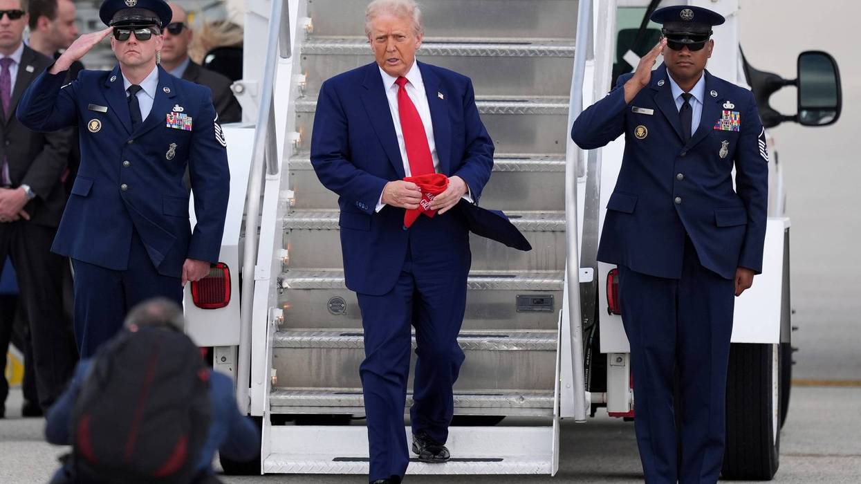 President Donald Trump, center, arrives on Air Force One at Miami International Airport, Thursday, April 3, 2025, in Miami.