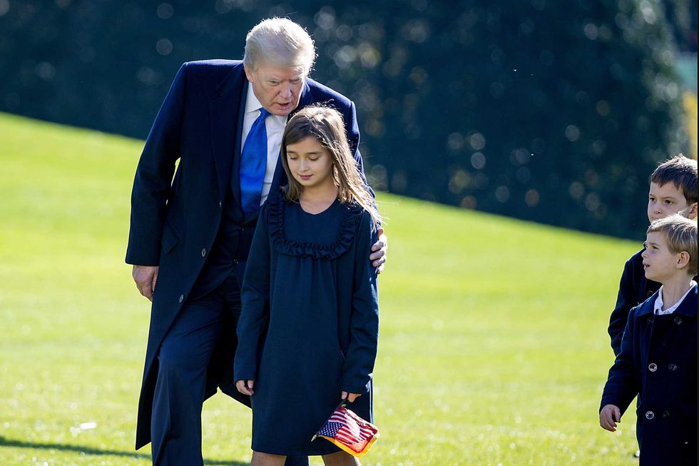 President Donald Trump, followed by his grandchildren, Arabella Kushner, Theodore Kushner, and Joseph Kushner get off Marine One on the south lawn of the White House on November 29, 2020 in Washington, DC. President Trump spent the weekend at Camp David and at Trump National Golf Club in Sterling, Virginia.