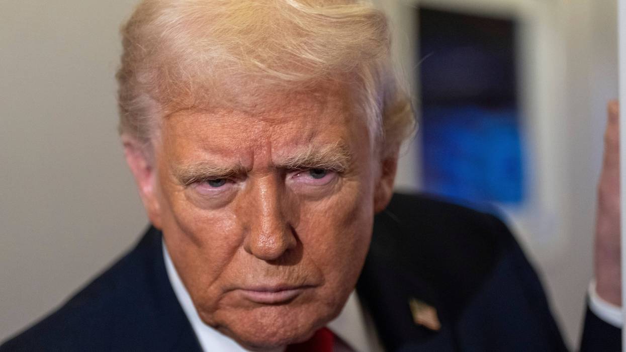 President Donald Trump leans in to hear a question as he speaks with reporters while in flight on Air Force One from Joint Base Andrews to his Mar-a-Lago estate in Palm Beach, Fla., Tuesday, Nov. 25, 2025.