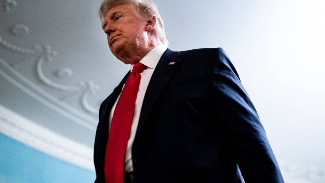 President Donald Trump leaves after speaking in the Diplomatic Room of the White House on Thanksgiving on Nov. 26, 2020, in Washington, D.C.