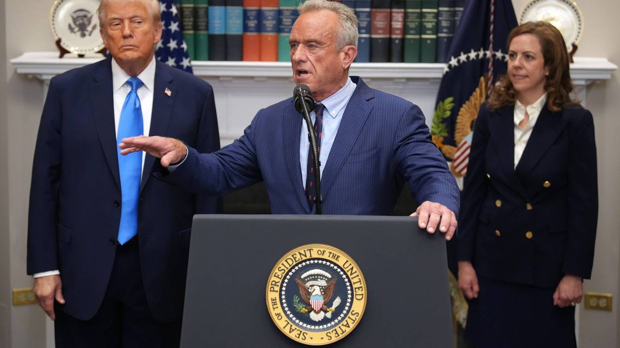 President Donald Trump, left, and Health and Human Services Secretary Robert F. Kennedy Jr., center.