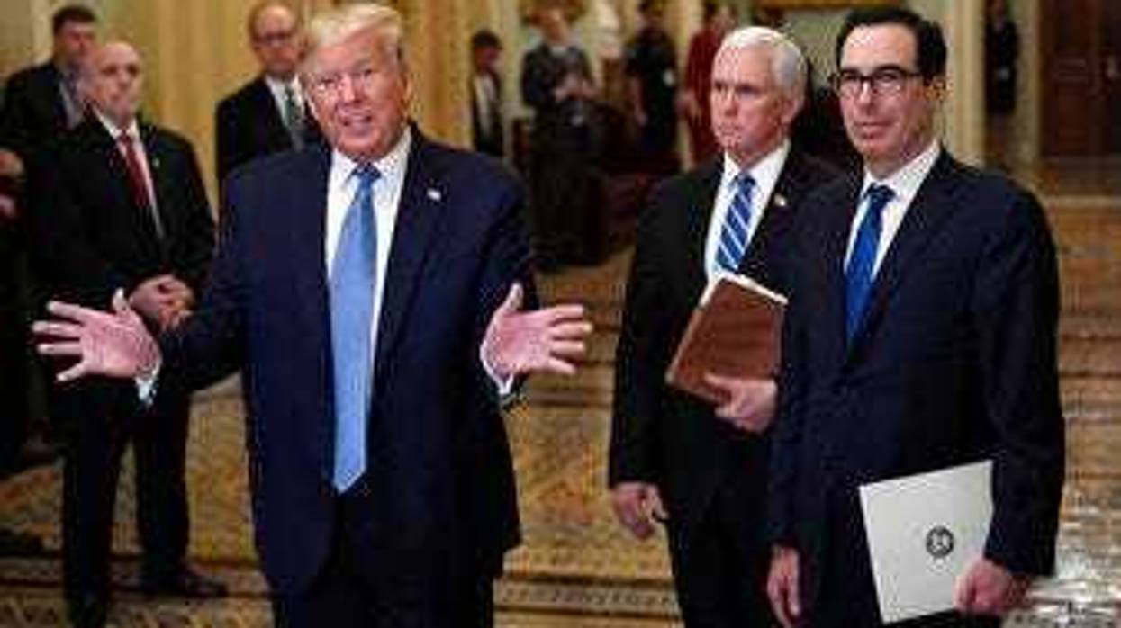 President Donald Trump, left, standing with Vice President Mike Pence and Treasury Secretary Steven Mnuchin, right, talks to reporters about the coronavirus outbreak on Tuesday, March 10, 2020, on Capitol Hill in Washington. (AP Photo/Susan Walsh)