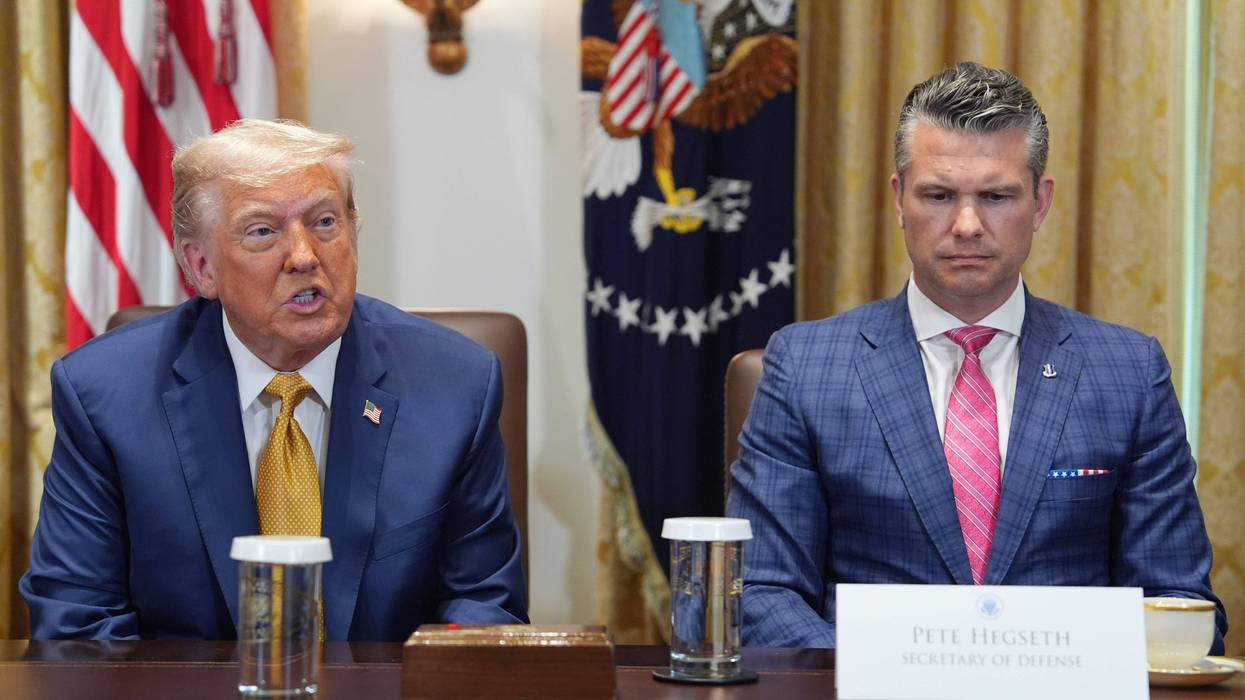 President Donald Trump, left, with Defense Secretary Pete Hegseth, right, during a cabinet meeting at the White House, Tuesday, July 8, 2025, in Washington.