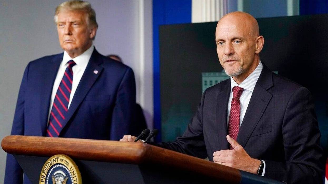 President Donald Trump listens as Dr. Stephen Hahn, commissioner of the U.S. Food and Drug Administration, speaks during a media briefing (AP)