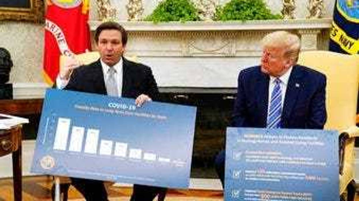 President Donald Trump listens during a meeting with Gov. Ron DeSantis, R-Fla., in the Oval Office of the White House, Tuesday, April 28, 2020, in Washington. (AP Photo/Evan Vucci)
