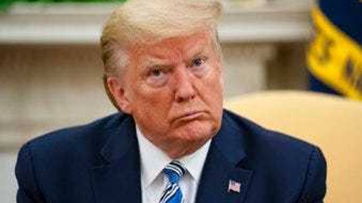President Donald Trump listens during a meeting with Gov. Ron DeSantis, R-Fla., on the coronavirus response, in the Oval Office of the White House, Tuesday, April 28, 2020, in Washington. (AP Photo/Evan Vucci)