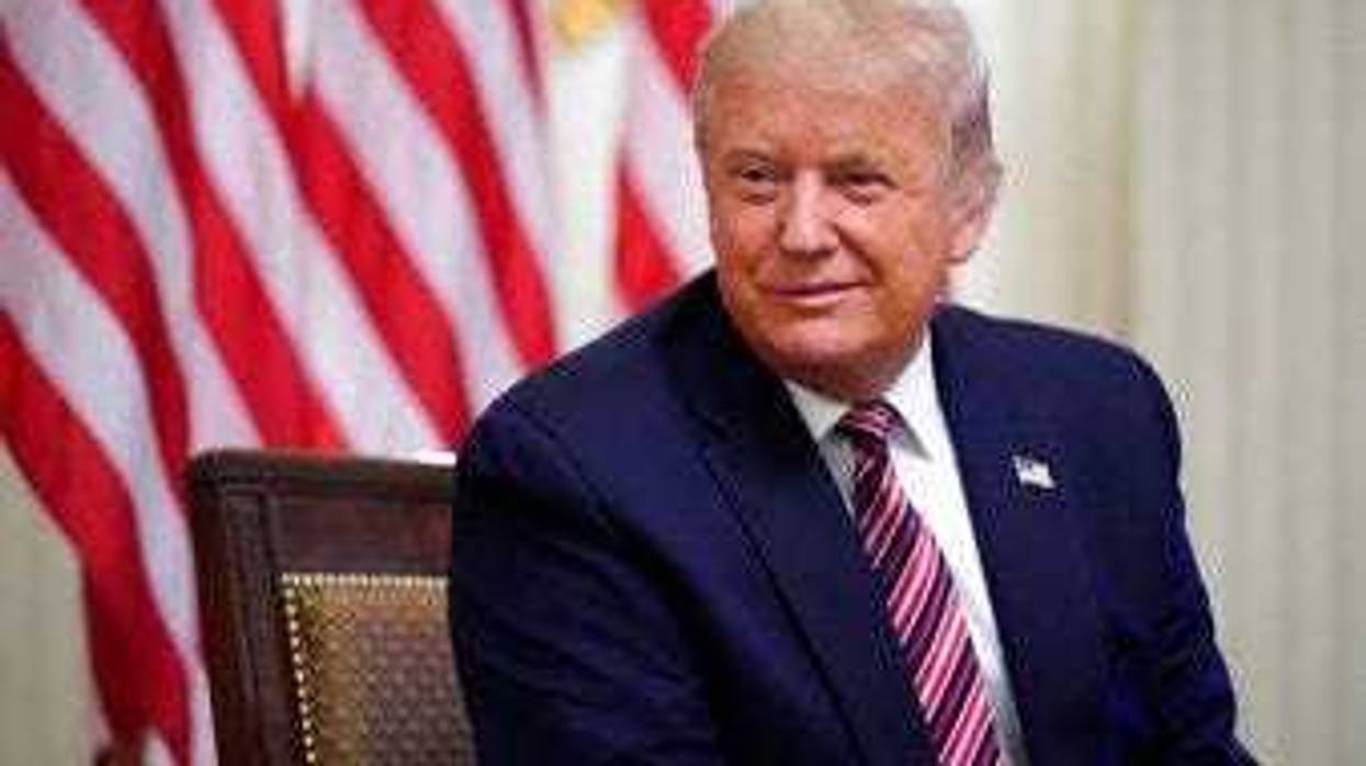 President Donald Trump listens during an event called "Kids First: Getting America's Children Safely Back to School" in the State Dining room of the White House, Wednesday, Aug. 12, 2020, in Washington. (AP Photo/Andrew Harnik)