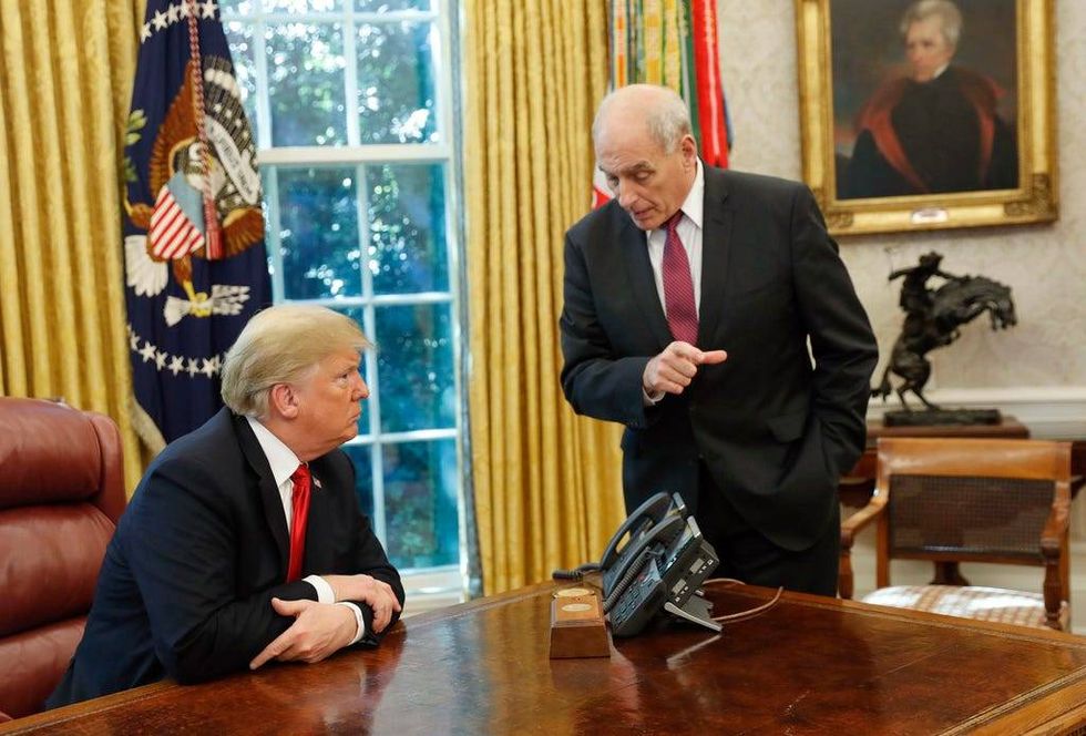 President Donald Trump listens to White House Chief of Staff John Kelly, right, in the Oval Office of the White House in Washington, Oct. 10, 2018.
