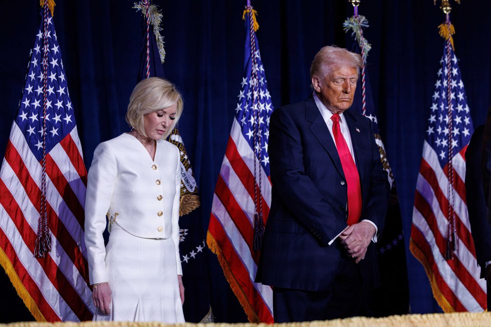 President Donald Trump participates in a prayer with Paula White (left) at the National Prayer Breakfast at the Washington Hilton in Washington DC, on Thursday, February 6th 2025.