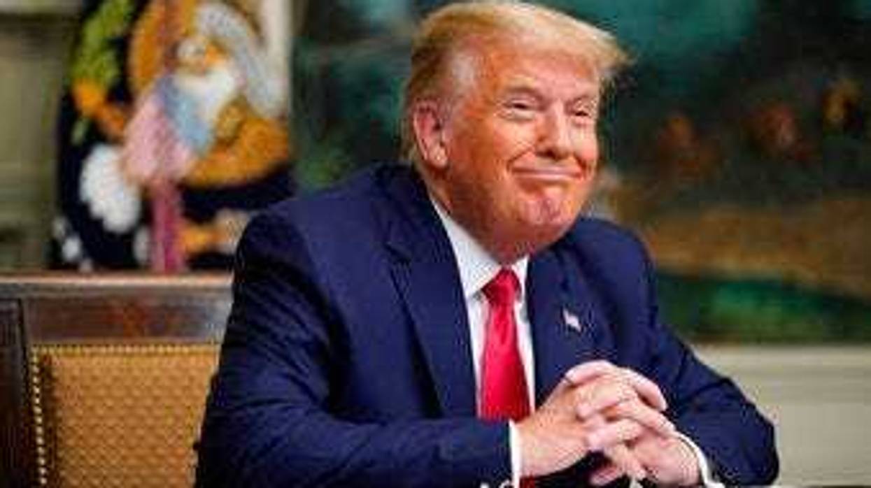 President Donald Trump participates in a video teleconference call with members of the military on Thanksgiving, Thursday, Nov. 26, 2020, at the White House in Washington. (AP Photo/Patrick Semansky)