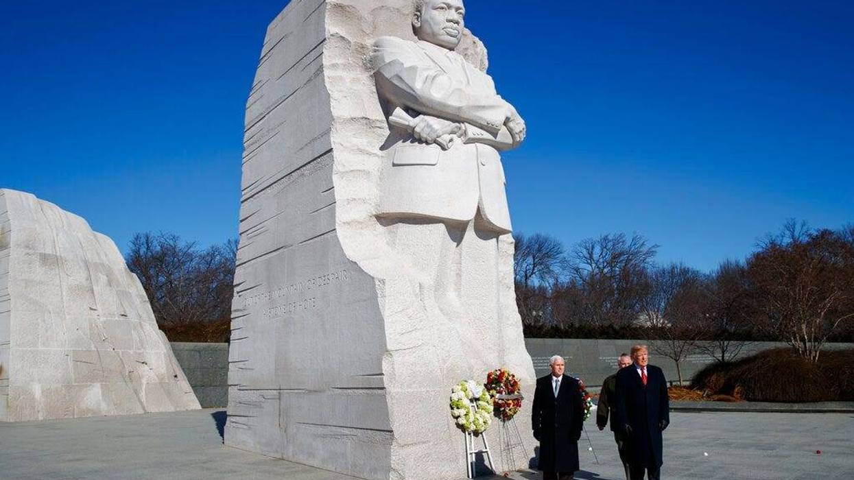 President Donald Trump, right, and Vice President Mike Pence, left, visit the Martin Luther King Jr. Memorial, Monday, Jan. 21, 2019, in Washington