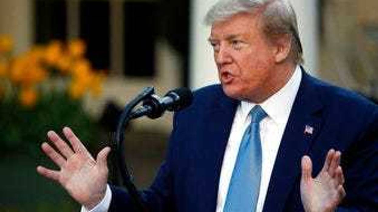 President Donald Trump speaks about the coronavirus in the Rose Garden of the White House, Wednesday, April 15, 2020, in Washington. (AP Photo/Alex Brandon)