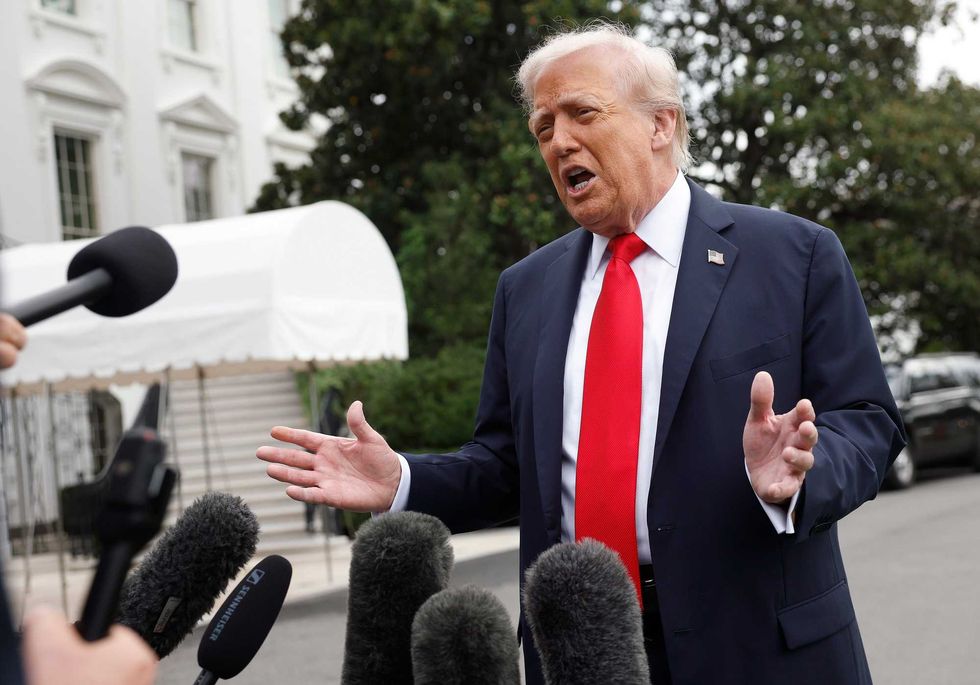 President Donald Trump speaks to members of the media as he departs the White House en route to London on September 16, 2025