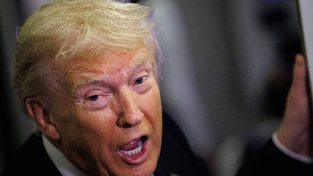 President Donald Trump speaks to reporters aboard Air Force One en route to the White House on November 2, 2025 after taking off from Palm Beach International Airport in West Palm Beach, Florida