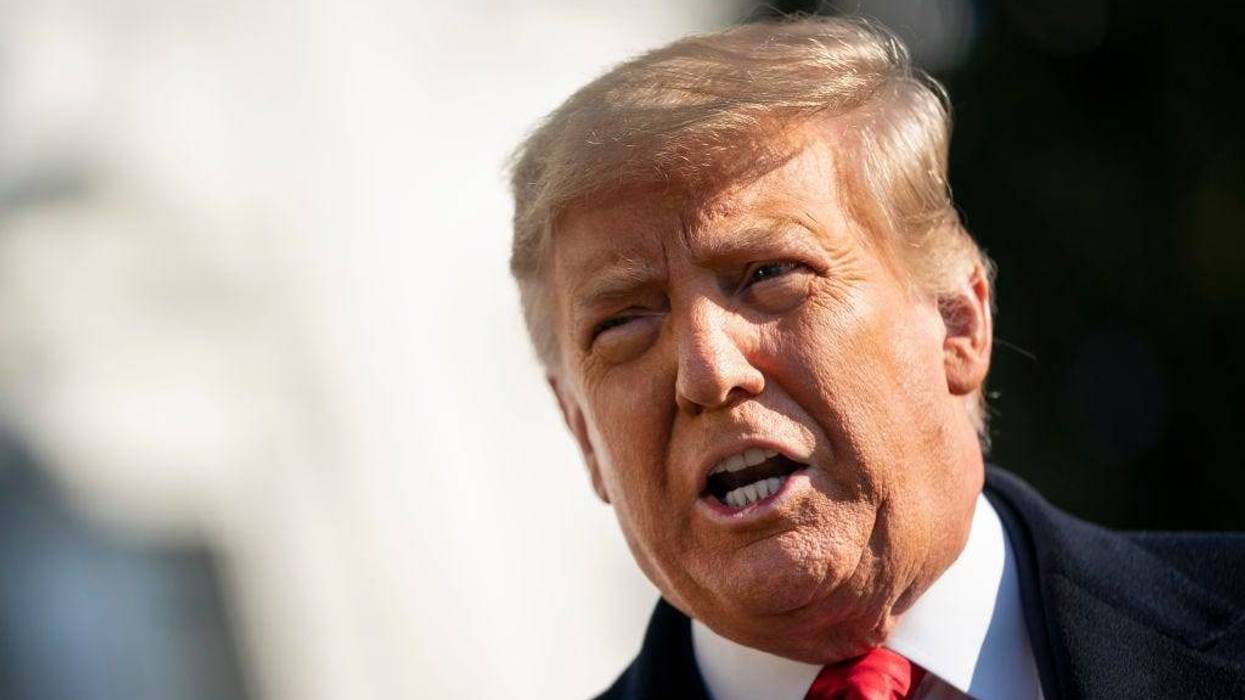 President Donald Trump speaks to reporters on the South Lawn of the White House before boarding Marine One on January 12, 2021 in Washington, DC.