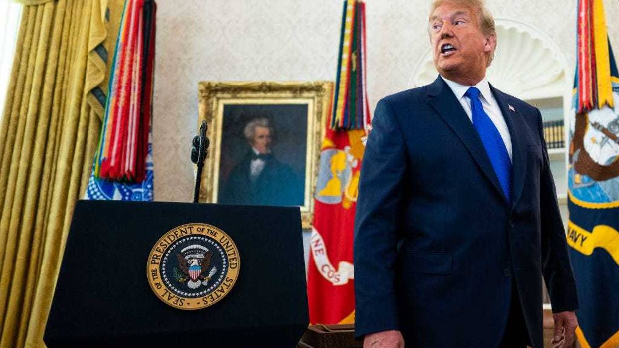 President Donald Trump speaks to the media after presenting the Presidential Medal of Freedom to Dan Gable in the Oval Office on December 07, 2020 in Washington, DC.