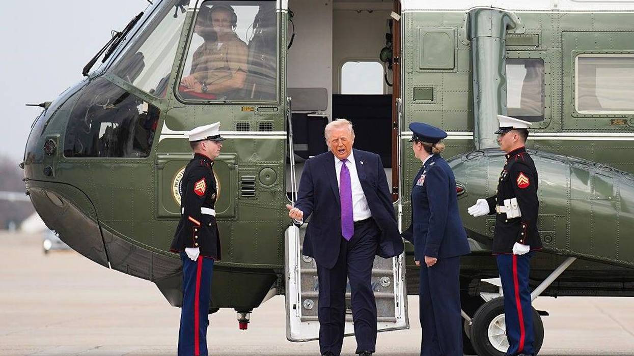 President Donald Trump steps down from Marine One to board Air Force One on March 11, 2026 at Joint Base Andrews, Maryland.
