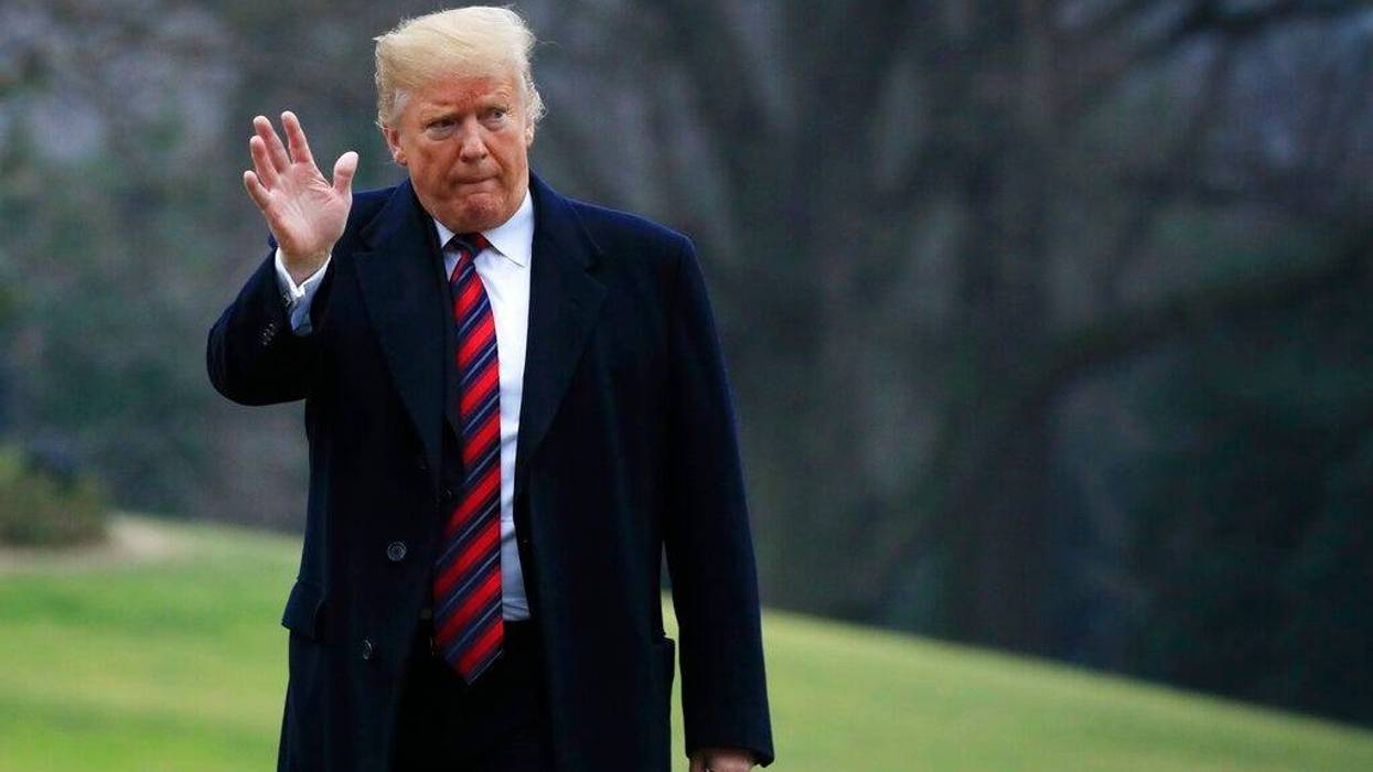 President Donald Trump walks on the South Lawn upon arrival at the White House in Washington, Saturday, Jan. 19, 2019