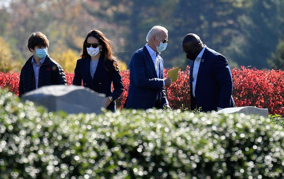 President-elect Joe Biden(2ndR) and his daughter Ashley Biden(C) leave after visiting their family grave site at St. Joseph on the Brandywine Roman Catholic Church in Wilmington, Delaware on November 8, 2020.