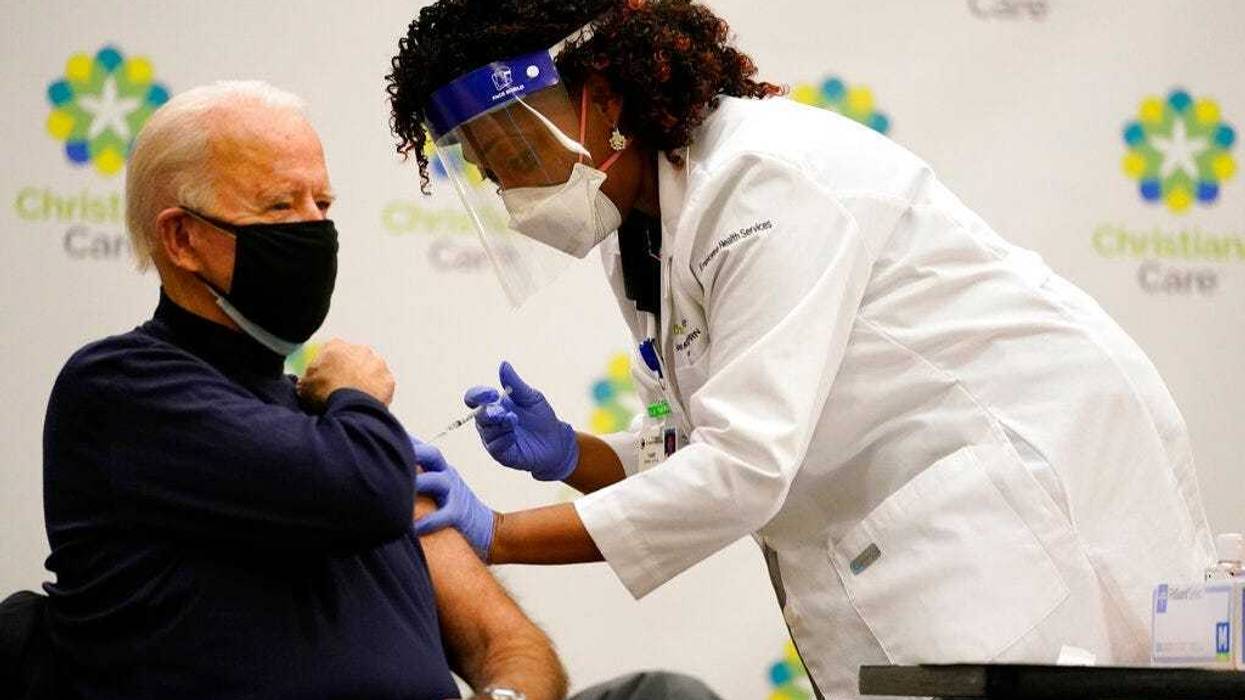 President-elect Joe Biden receives his first dose of the coronavirus vaccine at ChristianaCare Christiana Hospital in Newark, Del., Monday, Dec. 21, 2020, from nurse practitioner Tabe Mase. (AP Photo/Carolyn Kaster)