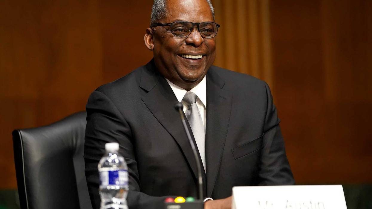 President-elect Joe Biden's nominee for Secretary of Defense, retired Army Gen. Lloyd Austin laughs at a joke made by Sen. Jack Reed (D-RI) at his confirmation hearing before the Senate Armed Services Committee at the U.S. Capitol on January 19, 2021 in Washington, DC. Previously Gen. Austin was the commanding officer of the U.S. Central Command in the Obama administration. (Photo by Greg Nash-Pool/Getty Images)