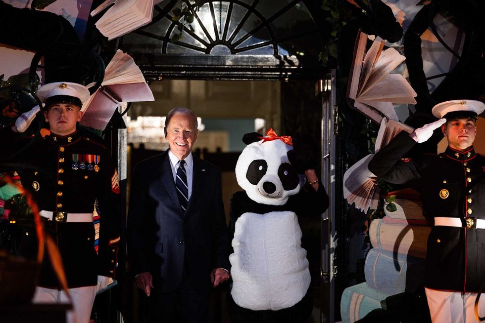 President Joe Biden and First Lady Jill Biden (R) arrive for a Halloween trick-or-treat event at the South Portico of the White House in Washington, DC, on October 30, 2024