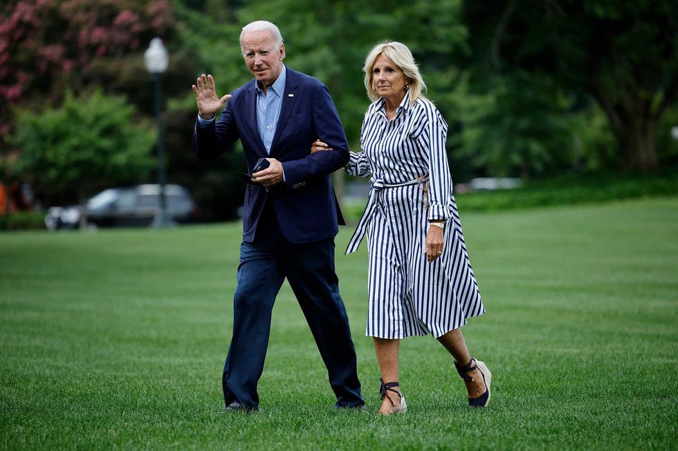 President Joe Biden and first lady Jill Biden walk across the South Lawn as they return to the White House on Aug. 08, 2022 in Washington, D.C