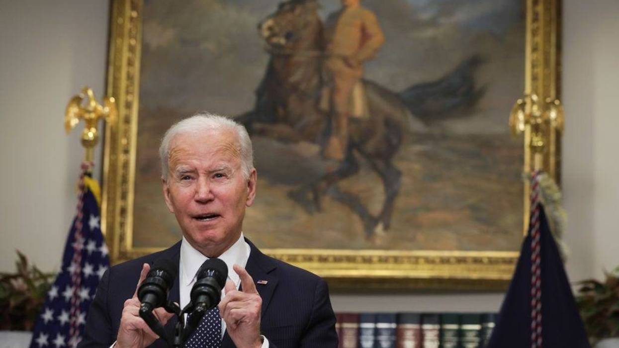 President Joe Biden at podium addressing media