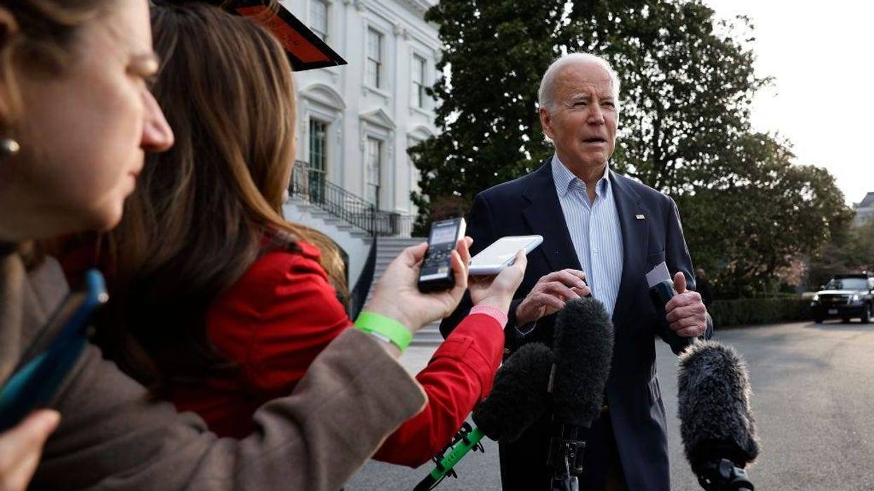 President Joe Biden declines to comment after reporters question him about the criminal indictment of former President Donald Trump