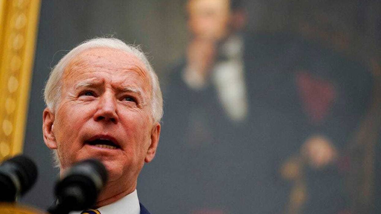 President Joe Biden delivers remarks on the economy in the State Dining Room of the White House, Friday, Jan. 22, 2021, in Washington. (AP Photo/Evan Vucci)