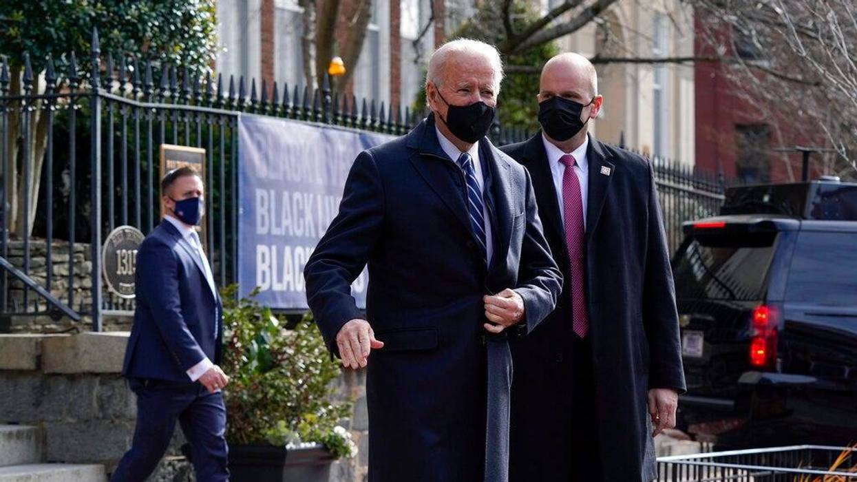 President Joe Biden departs after attending Mass at Holy Trinity Catholic Church, Sunday, Jan. 24, 2021, in the Georgetown neighborhood of Washington. (AP Photo/Patrick Semansky)