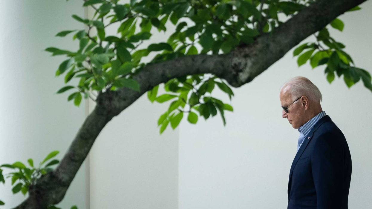 President Joe Biden exits the Oval Office.