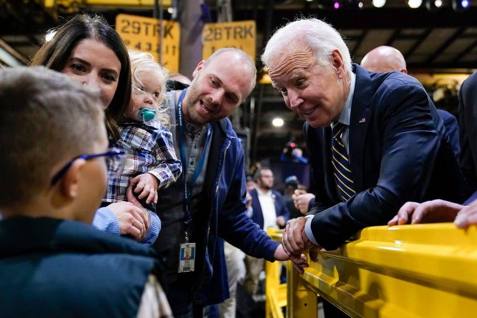 President Joe Biden greets audience members after speaking at the Amtrak Bear Maintenance Facility, Monday, Nov. 6, 2023, in Bear, Del.
