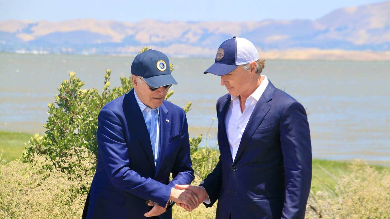 President Joe Biden (L) and California Gov. Gavin Newsom shaking hands in Palo Alto while discussing new federal funding to fight climate change on Monday, June 19, 2023.