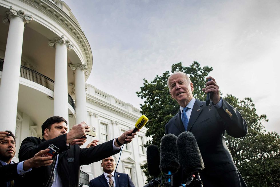 President Joe Biden speaks to members of the media on the South Lawn of the White House before boarding Marine One in Washington on March 23, 2022