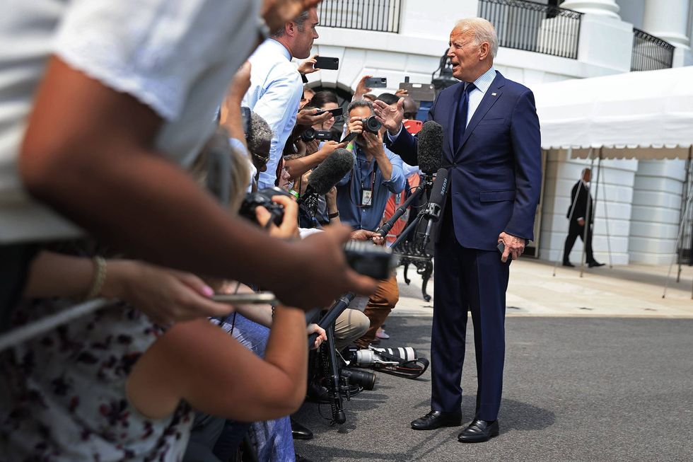 President Joe Biden stops to take a question before departing the White House.
