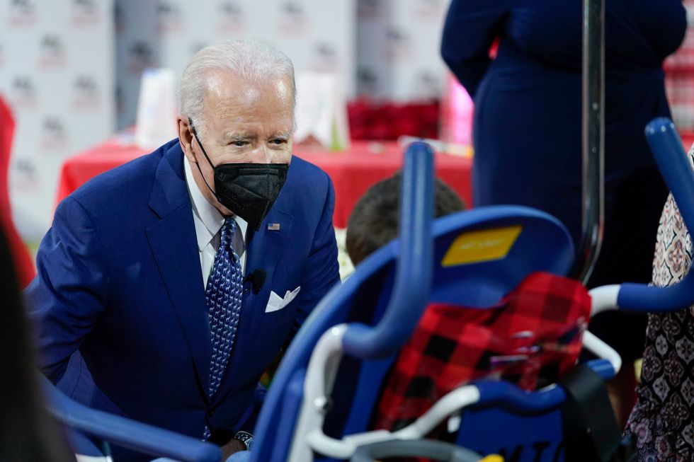 President Joe Biden visits with a patient at Children
