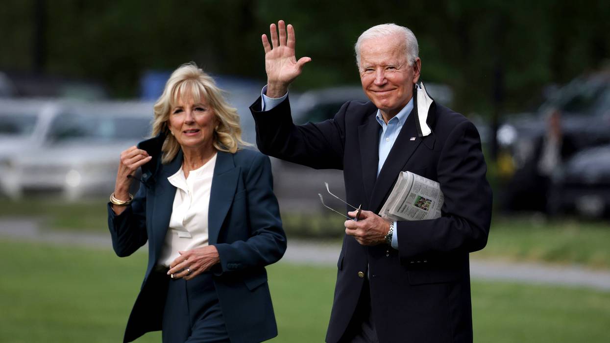 President Joe Biden waves as he and First Lady Jill Biden board Marine One headed to the G-7 summit in the UK.