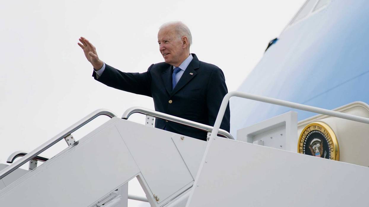 President Joe Biden waves as he boards Air Force One at Andrews Air Force Base, Md., Wednesday, March 23, 2022