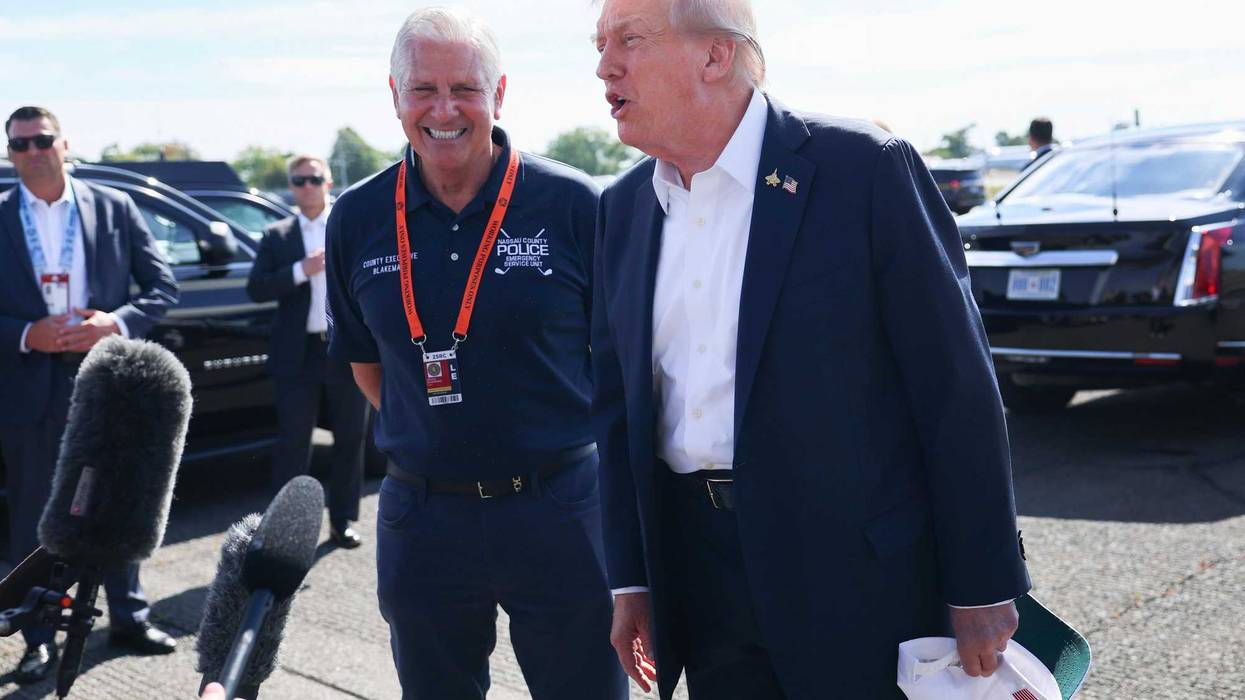 President Trump is greeted by Bruce Blakeman after arriving at the Republic Airport on Air Force One on September 26, 2025 in Farmingdale