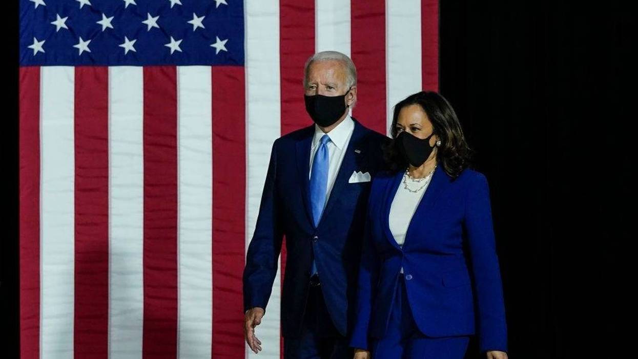 Presumptive Democratic presidential nominee former Vice President Joe Biden and his running mate Sen. Kamala Harris (D-CA) arrive to deliver remarks at the Alexis Dupont High School on August 12, 2020 in Wilmington, Delaware.