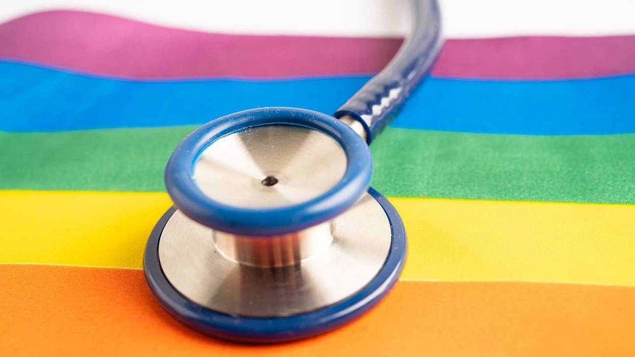 Pride flag and stethoscope.