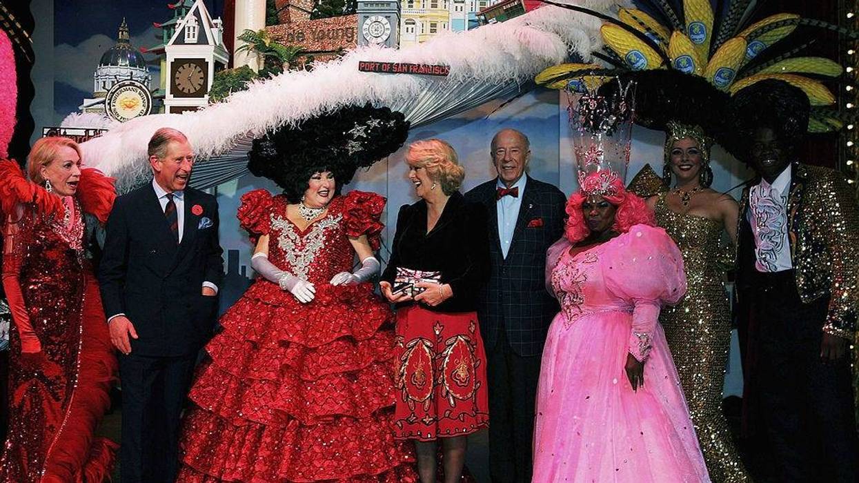 Prince Charles, Prince of Wales (2nd from L) and Camilla, Duchess of Cornwall (C) meets the cast at a performance of Beach Blanket Babylon November 6, 2005 in San Francisco.