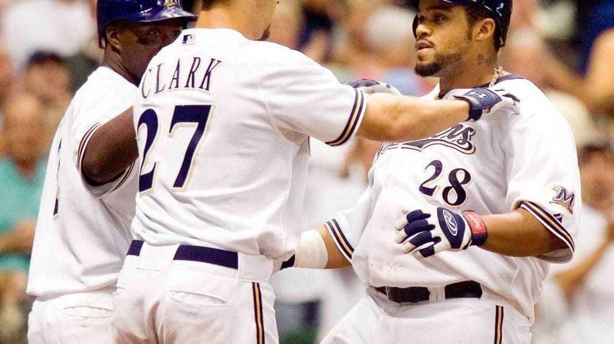 Prince Fielder is congratulated by Brady Clark and Bill Hall after hitting a monster three run homer in the 7th inning against the Colorado Rockies Thursday August 24, 2006. Brewers25 Spt Lynn 7