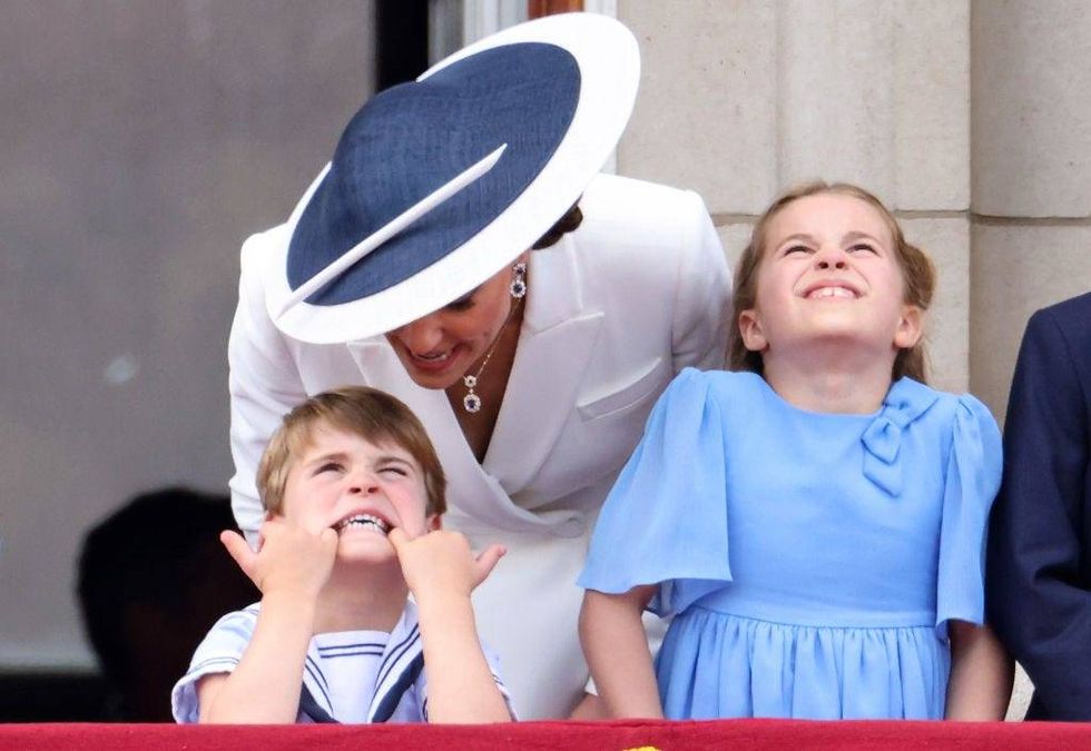 Prince Louis of Cambridge. pulls a face as he watches the RAF flypast with Catherine, Duchess of Cambridge and Princess Charlotte of Cambridge