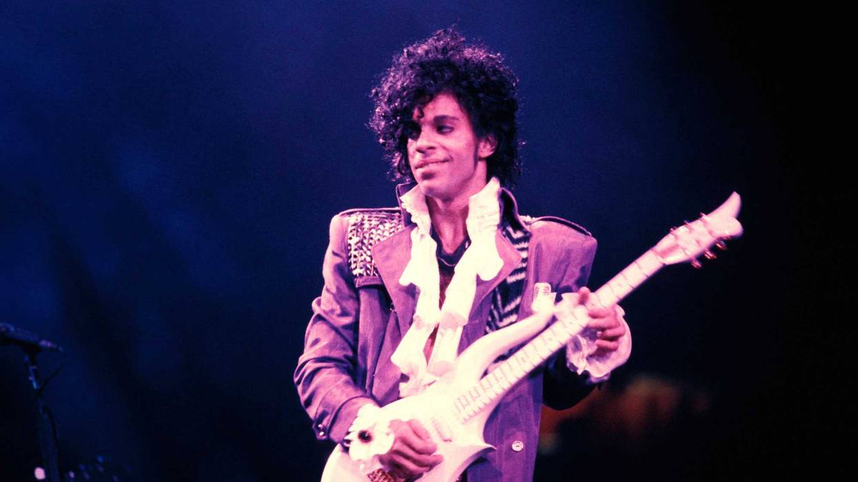 Prince performing on stage during the "Purple Rain Tour" in 1984.