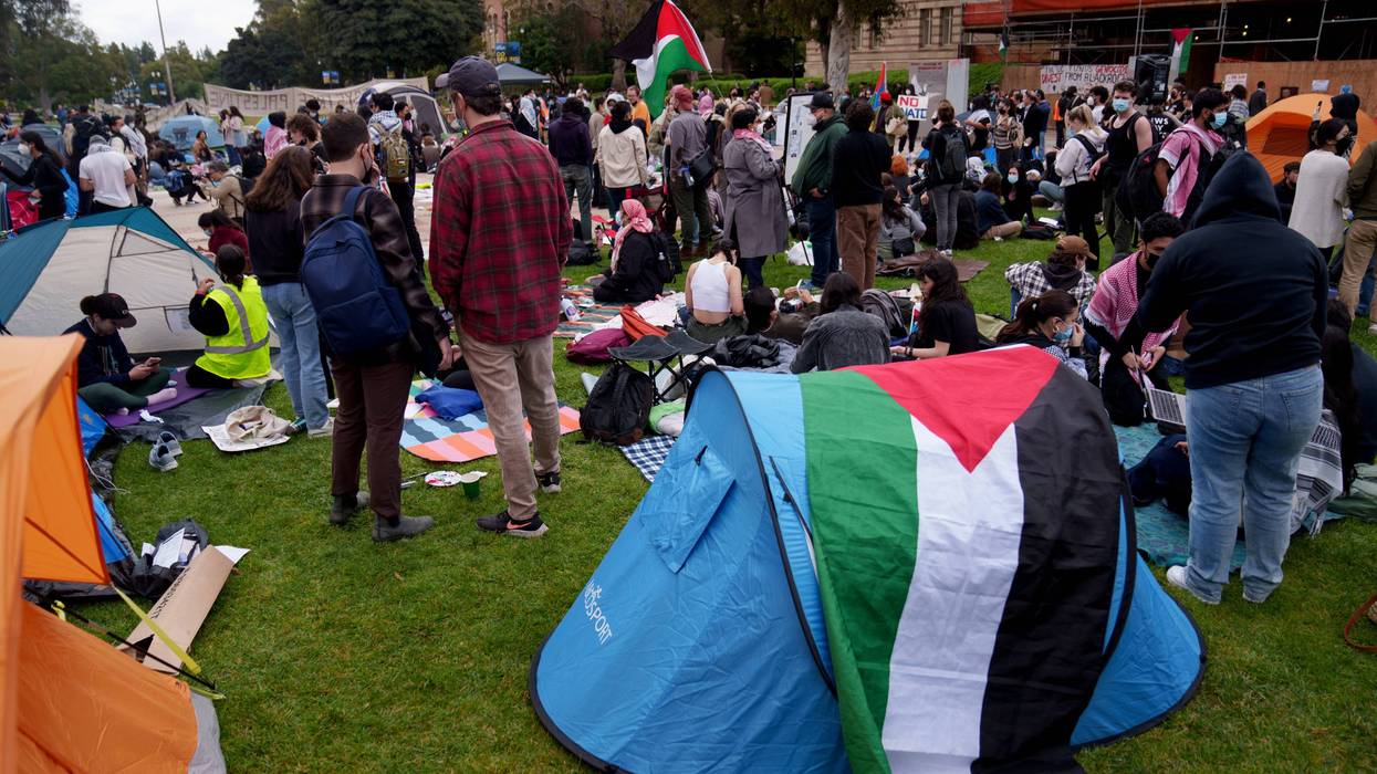 Pro-Palestine demonstrators occupy an encampment on the campus of UCLA on April 25, 2024 in Los Angeles, California. Activists at UCLA have joined a range of campuses across the United States who have started encampments to call on their universities to divest financial ties from Israel.