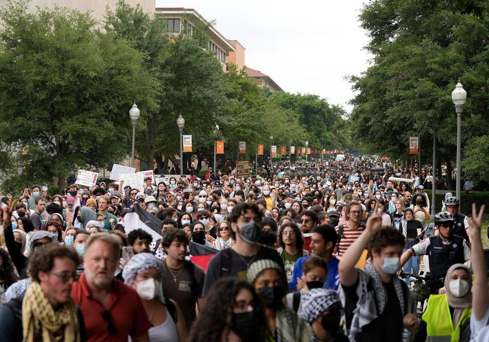 Pro-Palestinian protesters march at the University of Texas